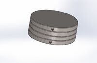 Front side view of main device. Two holes. One hole connecting a tube to the exterior of the leg