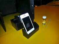 A camera phone is placed in front of the fluorimeter. Photo: Thurs 9:30am Group 9